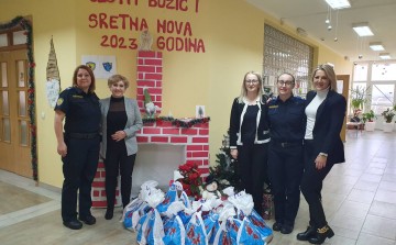 Policewomen in a humane donation campaign