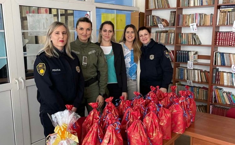 Policewomen in a humane donation campaign